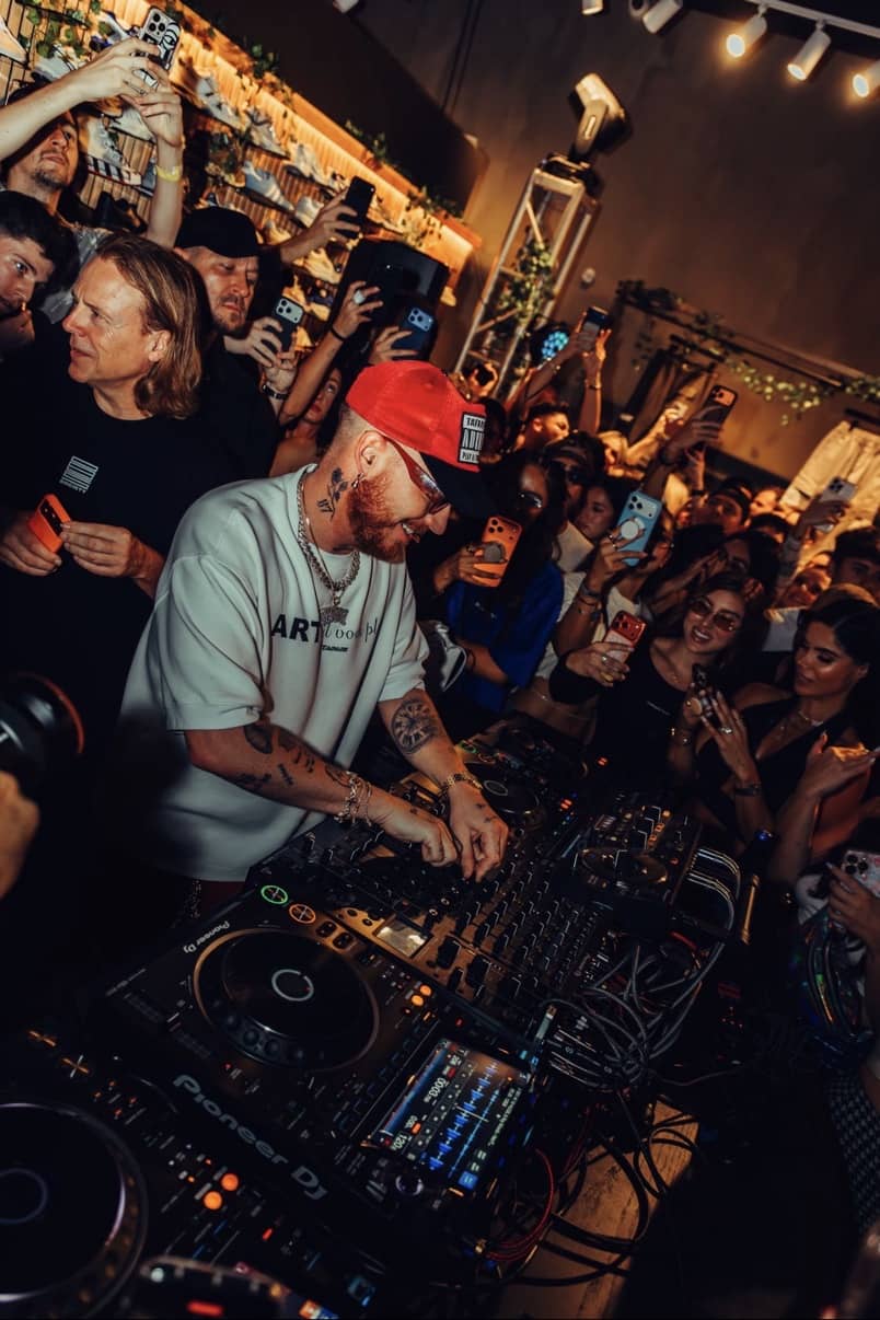 HUGEL at the decks surrounded by the crowd