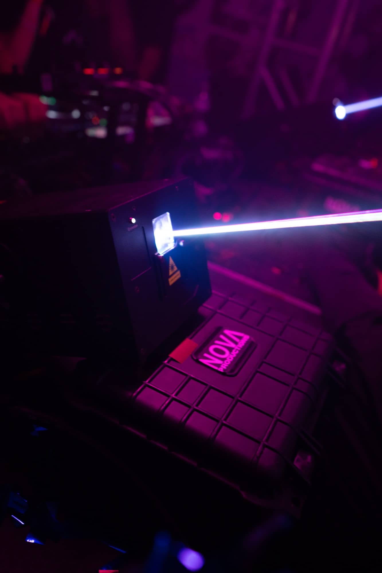 Show laser firing a beam across a Nova Productions road case