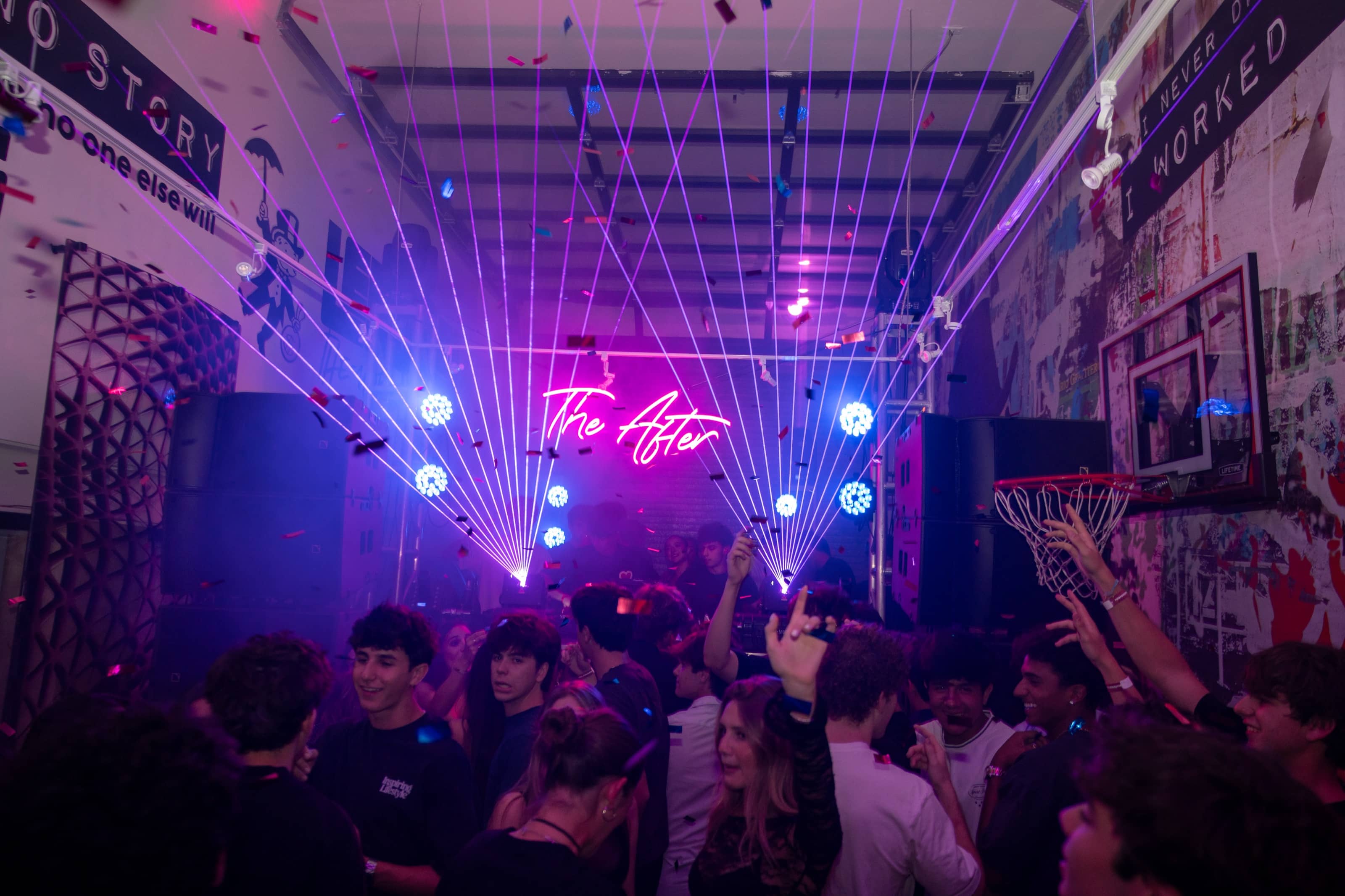 The show: laser fans and confetti over a full floor in the same room